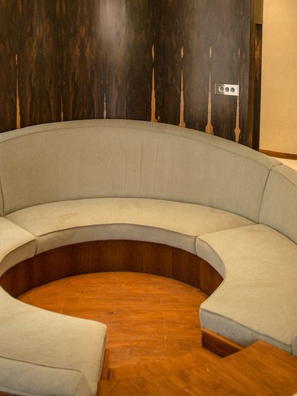 The sunken seating area in the Outré House, which corresponds to the custom light fixture on the floor below. This is an example of how we create integrated design elements that connect different spaces.