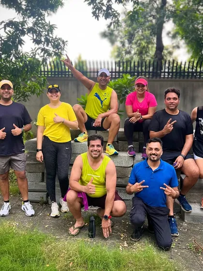 "Jab we met running!" A classic post-run group pose. We are a community of friends who found each other through our shared passion for running.