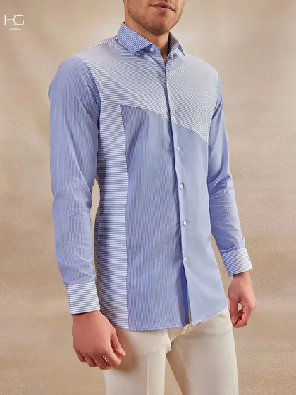 A well-made shirt is the foundation of a man's wardrobe. This piece, with its unique striped paneling, is designed to be versatile enough for the boardroom yet stylish enough for an evening soirée.