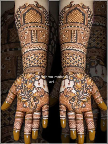 A beautiful design featuring peacocks surrounded by lotus flowers on the palms. The arms are adorned with traditional jharokha windows and geometric patterns, creating a rich and detailed look.