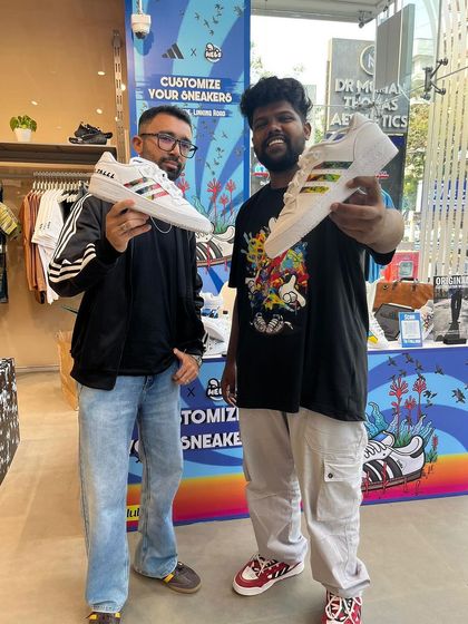 Two sneaker enthusiasts showing off their freshly painted kicks. We can work with a variety of styles, from colorful stripes to subtle personalizations.