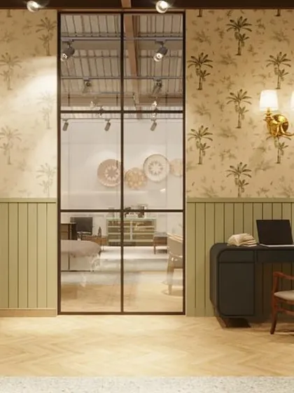 A small home office vignette, framed by industrial-style glass doors. This setup helps customers visualize how Gulmohar Lane's pieces can create a functional and stylish workspace at home.