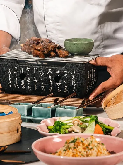 We believe every meal is a celebration. Our chef artfully prepares grilled delicacies on a traditional hibachi, bringing smoky, indigenous flavors directly to your table for a memorable dining experience.