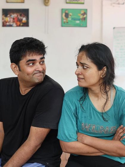 A candid moment between the two actors of "Gretel" during a break in rehearsals.