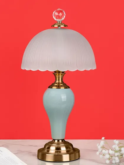 A soft, pastel blue base gives this dome lamp a serene and gentle feel. It's a perfect choice for a bedside table or a quiet corner, providing soft, diffused light.