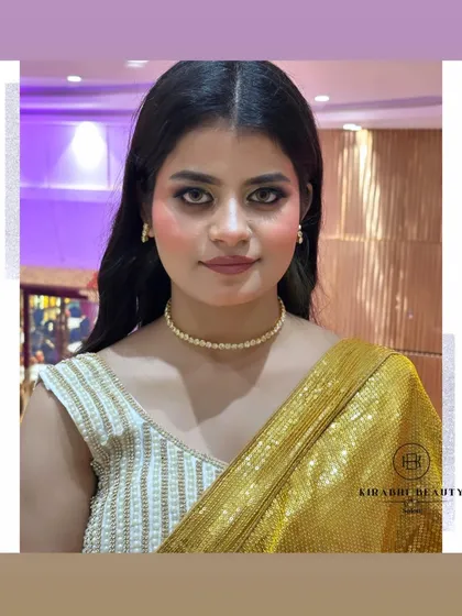 A simple yet stunning look for an evening out. The focus is on flawless skin and shimmery gold eyes, paired with a simple pearl choker.