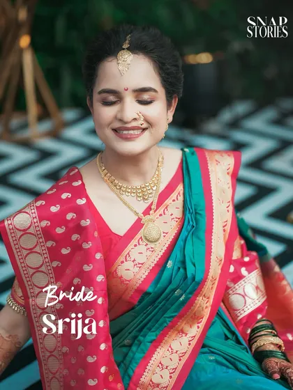 A beautiful portrait of a Maharashtrian bride, her eyes closed in a moment of quiet joy. We focus on capturing serene and graceful bridal shots.