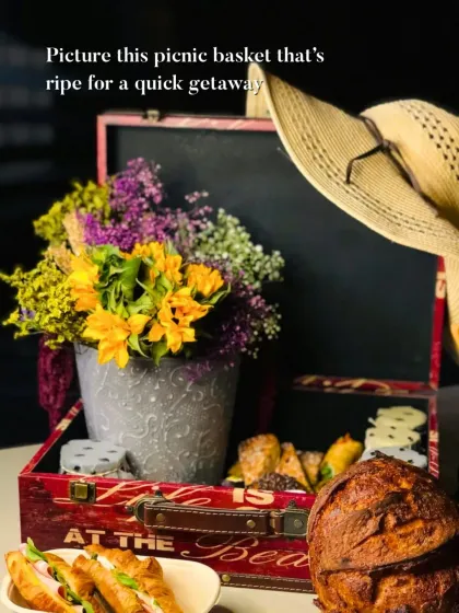 This is what a perfect getaway looks like. I curated this vintage-style picnic basket with fresh sourdough, artisanal savories, and a bouquet of flowers, turning a simple outing into a memorable affair.