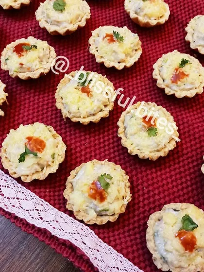These bite-sized Creamy Chicken and Cheese Tarts are a party favorite. Each tart has a buttery, flaky crust filled with a rich, savoury chicken and cheese mixture, perfect for passing around.