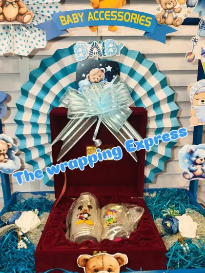 This cart from the gift train holds a special silver bowl and glass set for the baby, presented in a velvet box.