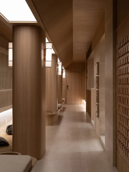 A view of the corridor, showing the rhythmic placement of pillars and light fixtures.
