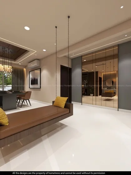 A view of the open-plan living and dining area, featuring a comfortable indoor swing. The consistent flooring and neutral wall colors create a seamless flow between the different functional zones.