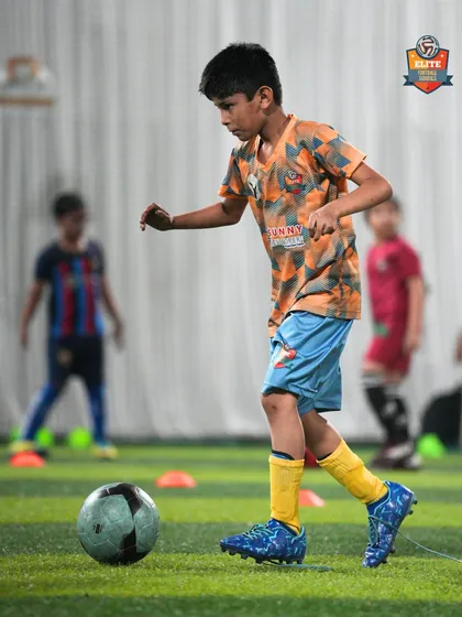 A player navigates a drill with cones, improving his agility and close-control dribbling.