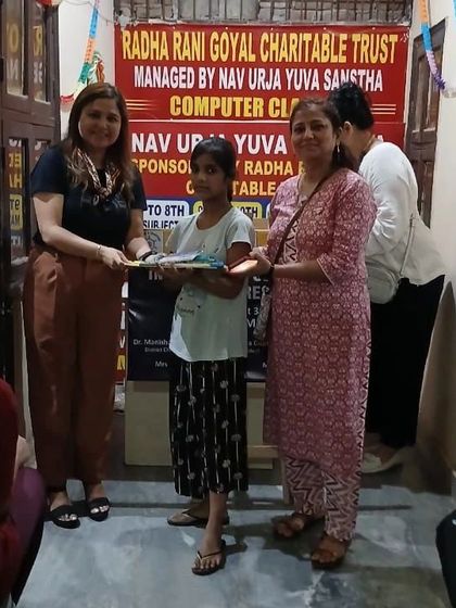 Presenting a student with her new school supplies. The smile on her face is the ultimate reward for our community outreach initiatives.