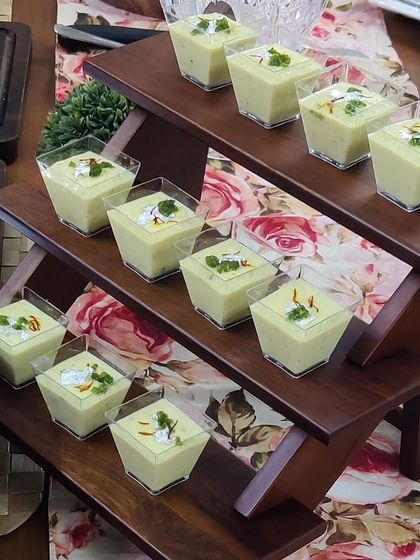 A modern take on a classic Indian dessert, this is our Chena Pais. It's a creamy, saffron-infused dessert made with fresh cheese, served in individual portions for easy enjoyment.