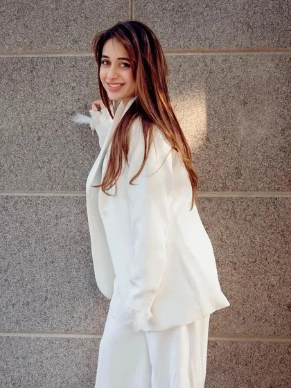 Another shot of this happy client in her white suit, showing how a great outfit can make you shine.