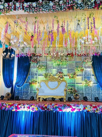 Another angle of the dreamy blue and wisteria stage, showing the beautiful way the drapes frame the setting.
