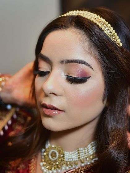 A final close up on the flawless makeup, showing the soft blend of eyeshadow and the perfect lip color. This type of shot is ideal for makeup artists and beauty portfolios.