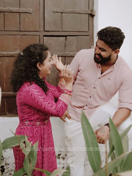 A playful moment between the couple, their laughter and interaction beautifully captured.