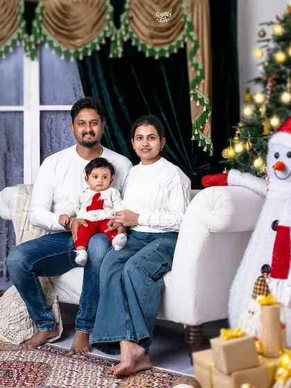 A classic family photo in front of the Christmas tree, capturing the love and magic of the holiday season.