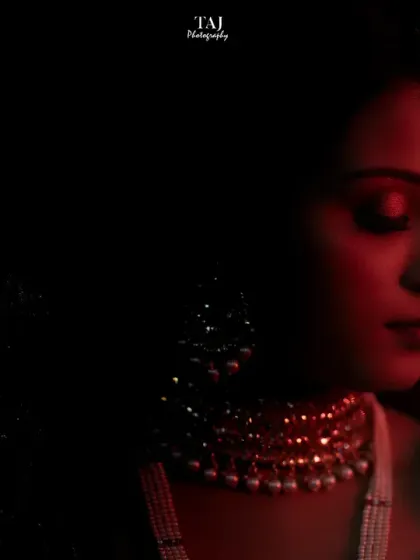 A dramatic double exposure portrait of the bride. The use of red light and shadow creates a powerful and artistic image.
