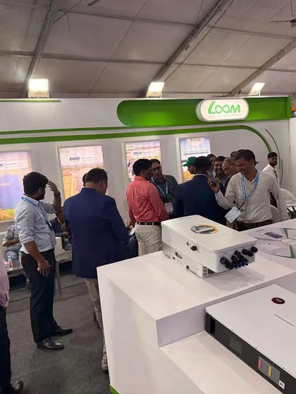 Visitors at my booth examining our energy storage products. Hands-on demonstrations are a core part of my expo strategy.