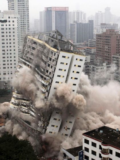 This image shows a building marked for demolition due to plan deviations. In such cases, I review the sanctioned plans and the alleged violations to determine if there is a legal basis to challenge the demolition order and protect the owner's investment.