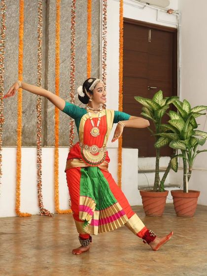 A young Kuchipudi dancer in a graceful pose.