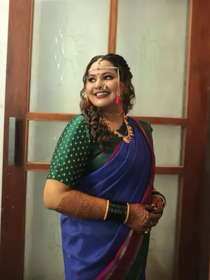 A candid, happy moment. The bride's makeup is kept fresh and light, allowing her natural beauty and joyful expression to be the focus.