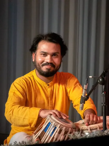 A gallery of cherished moments accompanying the legendary vocalist, Guruji Padma Bhushan Pandit Ajoy Chakraborty ji, at various prestigious festivals.