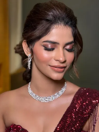 A soft, textured updo for an engagement or ring ceremony. The style is modern yet romantic, perfect for a bride who wants a less formal but equally beautiful look.