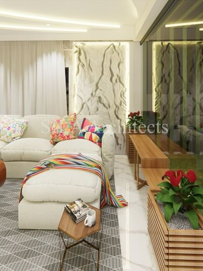 A visualization focusing on the seating area, with a large L-shaped sofa, colorful cushions, and an indoor planter that brings a touch of nature inside.