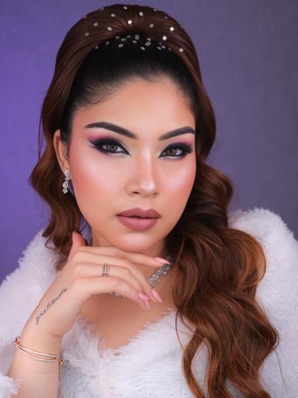 Dive into a world of glam and creativity with this purple and pink graphic eye makeup. The white liner detail adds a futuristic touch, perfect for a creative portfolio.