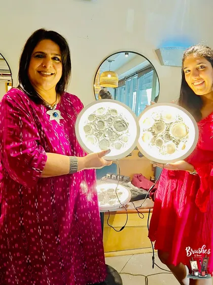 A mother and daughter proudly holding up their matching 3D moon lamps. A perfect way to create a shared memory and a beautiful piece of art.