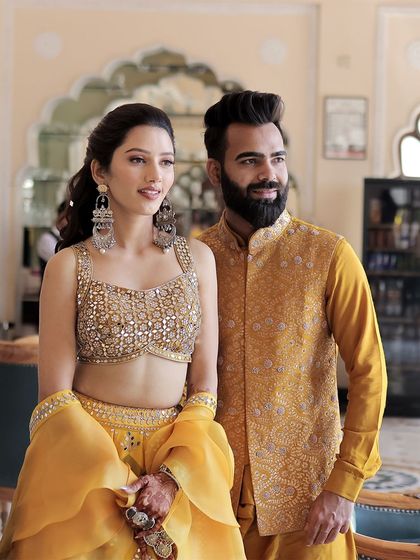 A candid portrait of the celebrity couple, Neetu and Lakhan, looking stylish and happy at their Haldi event.