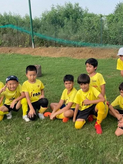 A team photo. The game of football is a holistic experience, and we prepare our players for success in football and in life.
