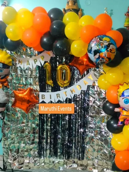 For the anime fans, a Naruto-themed 10th birthday party. This setup uses the show's signature orange and black colors, with character balloons and a silver foil curtain.