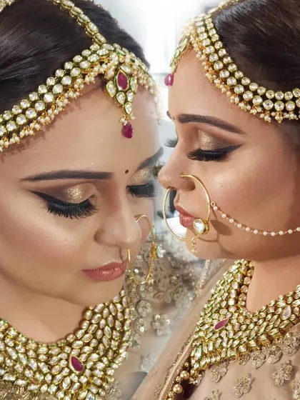 A closer look at the golden cut crease and winged liner. This artistic shot shows how the makeup defines and enhances the eyes from different angles.
