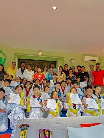 Another angle of our proud students and their families celebrating their achievements.