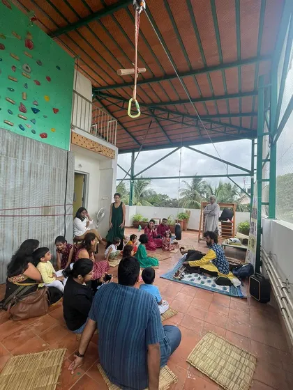Welcome to our rooftop learning space. Here, children and adults gather to explore, create, and learn from one another in a sunlit, open-air environment surrounded by nature.