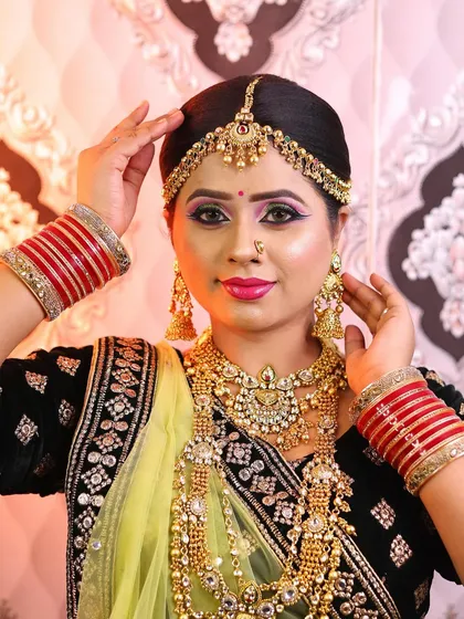 A stunning bridal look created for a demonstration, featuring heavy jewellery and a bright, confident expression.