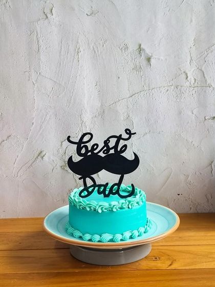 For the "Best Dad" ever, this cute mini cake with a mustache topper is a fun and loving tribute on Father's Day.