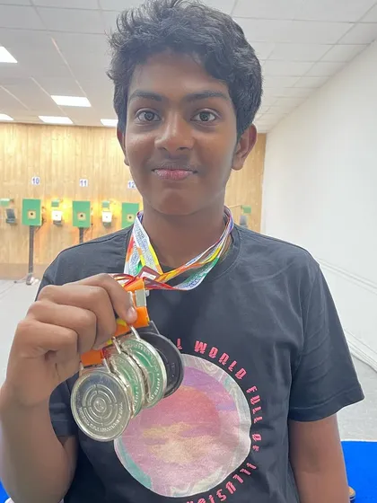 Vishal shows off his impressive collection of one bronze and three silver medals won at the South Zone shooting competition in Trivandrum.