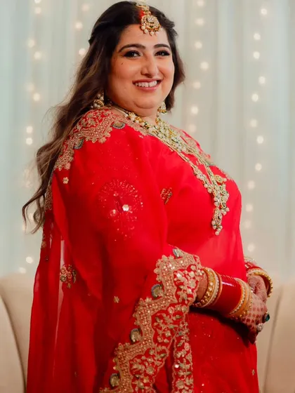 A collection of moments from this bride's reception. Her look was all about soft glam, with flowing waves and makeup that highlighted her joyful smile, creating a perfect look for her evening celebration.