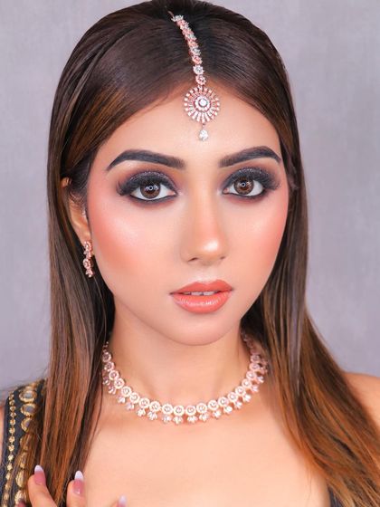 This glittery smokey eye, created by our student Reena, is perfect for a cocktail party or reception. We teach how to master glitter application for a high-impact look.