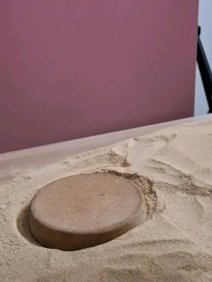 A behind-the-scenes look at creating a sand dune effect for a desert-themed cosmetic shoot.