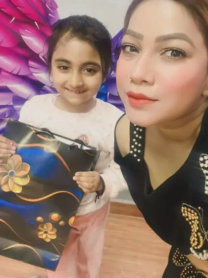 The priceless smile of a student receiving her gift. We believe in celebrating every milestone and achievement.