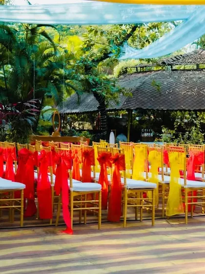 Even the chairs get a pop of color. Here, we used alternating red and yellow sashes to tie into the bright, festive theme of the event.