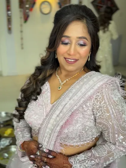 A close-up showing the beautiful details of her outfit and the way the makeup enhances her features.