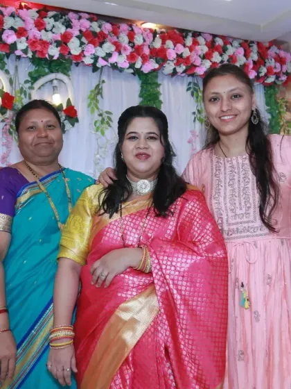 A lovely group photo of the women in the family, beautifully dressed and gathered to celebrate the new arrival.